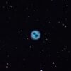 A blue nebula surrounded by stars in space