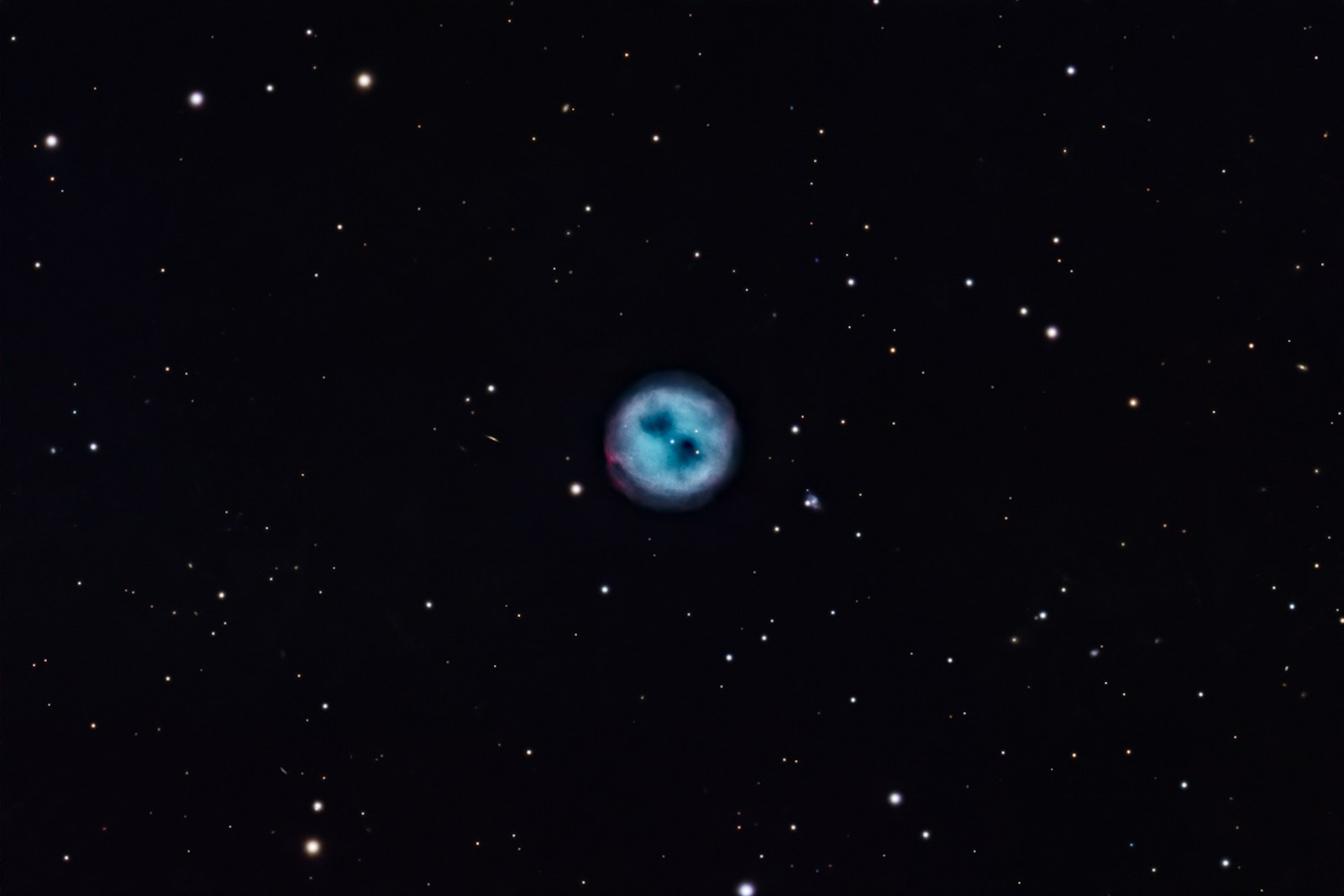 A blue nebula surrounded by stars in space