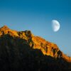 Mountain peak illuminated by the moon.