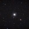 A dense star cluster in the night sky.