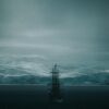 A ship sails in a cold, icy seascape.