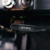 Close-up of a vintage car's brake lever.